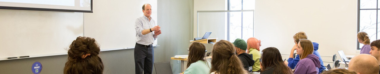 Professor with students lecturing
