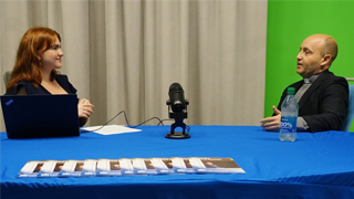 Fr. Alvaro Ramos with a student making a podcast.