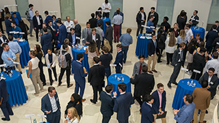 Students speaking with professionals at the annual Finance Networking Forum.