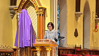 Professor Zaccaron reading at Lenten Mass