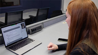 A student working on a computer.