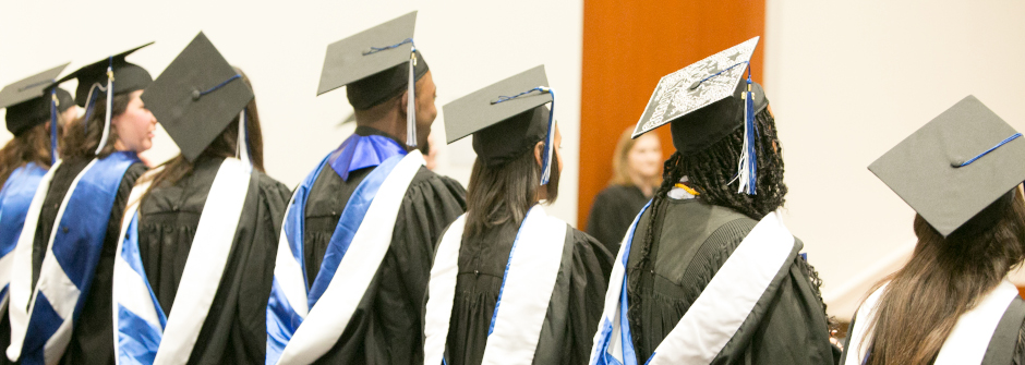Graduate students at a commencement ceremony.