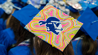 Graduation cap with Seton Hall pirate logo on it