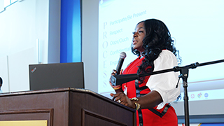 Keynote speaker Issata Oluwadare addressing conference attendees