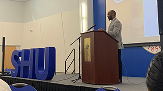 Brandon Larmore gives a keynote address.