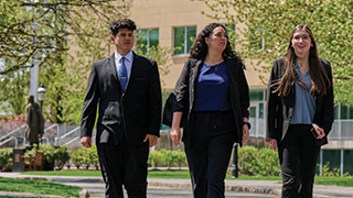 A group of Buccino Leadership Institute students walking on campus.