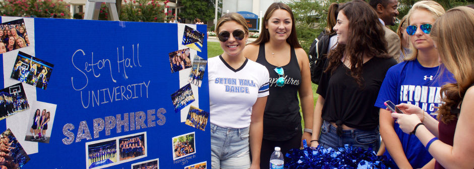 Students at a booth for the involvement fair. 