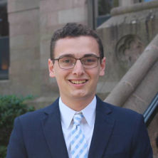 Jacob Abel in front of President's Hall. 