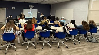 janis aldridge addressing students
