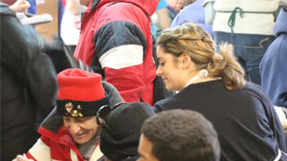 Image of a Seton Hall student volunteering at a soup kitchen.