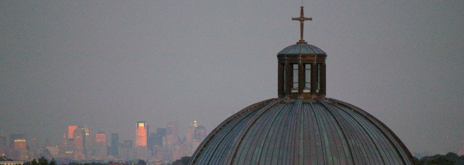 A shot of Mooney Hall with the skyline in the backgroud. 