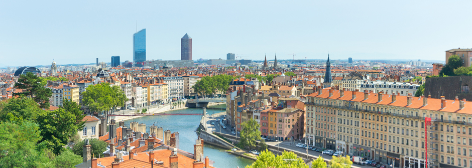 An image of the bridge and the city during the day of Lyon, France. 