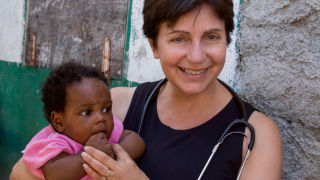 Mary Ann Lofrumento with a baby 