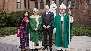 McCarren3 Following Mass, Monsignor McCarren was greeted by many well wishers, among them, Archbishop Joseph Tobin, Interim President Katia Passerini, and Interim Provost Erik Lillquist.