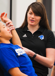 Mercedes Cunningham working with athlete