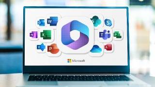 Laptop displaying Microsoft app logos.