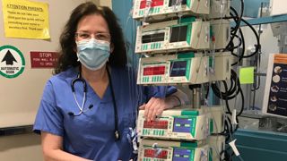 Moira receiving the covid vaccine.Moira Kendra, nurse at Morristown Medical Center during COVID lockdown.