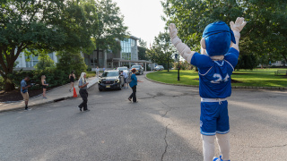 Pirate mascot waving in cars