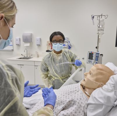 SHU MS SLP student works with mannequin