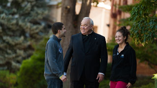 Monsignor Cafone talking to students