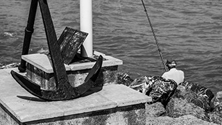 An image depicting an older man at sea.