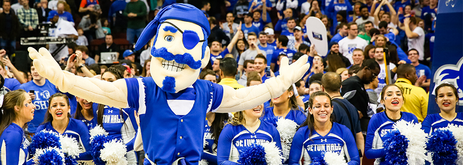 Pirate mascot and students at basketball game