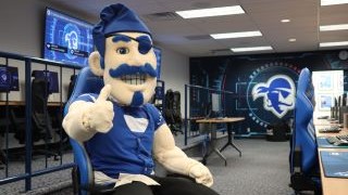 Seton Hall's Pirate mascot in the esports lab.