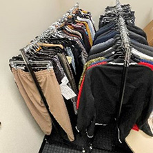 A photo of the Pirate's Closet team.A photo of clothes on a rack.