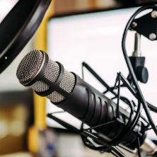 Image of a microphone in a studio.