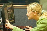 Student pointing at computer screen