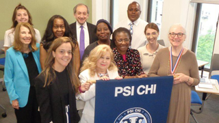 Prof. Brady-Amoon with members of Psi Chi. Prof. Brady-Amoon with members of Psi Chi.