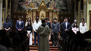 OCIA catechumens and their sponsors praying for the grace of God.