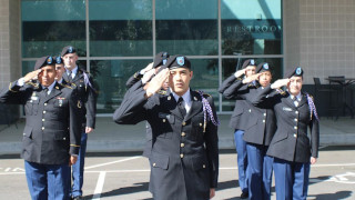 Pirate Battalion in dress uniforms performing a salute 