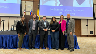 Dean Kaiser, Dean Farina and Joseph Hehl '86 pictured with students at the Pinning Ceremony.