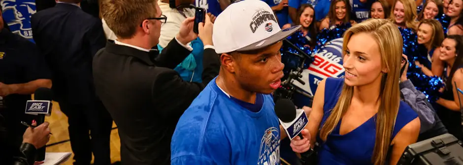 SHU Student interviewing basketball player