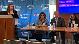 A group of scholars attending a colloquium at St. John's University.