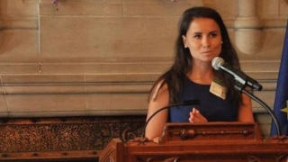 Stephanie Fillion speaking at a podium