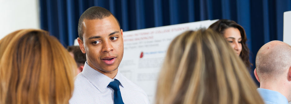 Students speaking at Petersheim expo.