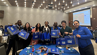 Divisional members fill student bags.