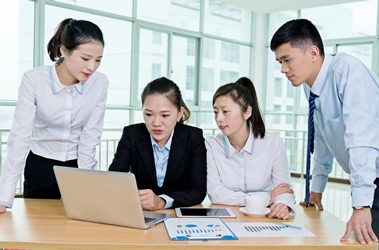 Students reviewing business classwork