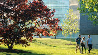 An image of students walking on campus near McNutly.