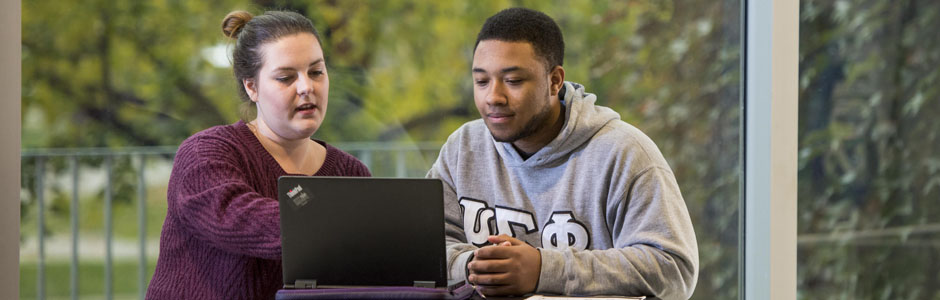 Students using a laptop