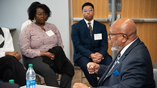 Students gather to hear Ambassador Dennis Francis.