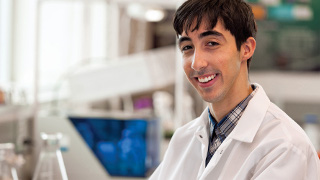 Yansel Nunez in a biology lab.