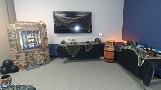 Pirate ship-themed escape room set up in Walsh Library Beck Room A.