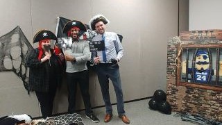 Members of the Seton Hall's Division of Student Services with pirate themed dress up gear.