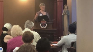 Image of a speaker at St. Catherine's RetreatImage of a woman asking a question at the St. Catherine retreatImage of a speaker at St. Catherine's Retreat