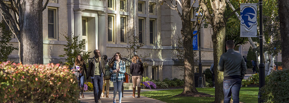 students walking on campus in the fall