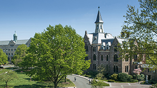 A photo of Presidents Hall and the University Green.