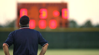 Umpire observing Baseball Scoreboard